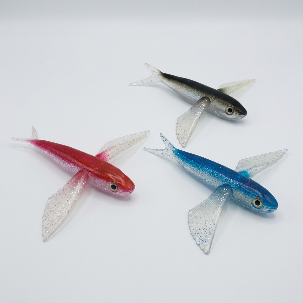 Pez volador de silicón en colores rojo, negro y azul para pesca de atún