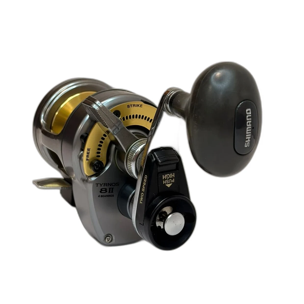 Carrete Shimano Tyrnos 8II de dos velocidades, cuerpo gris y dorado